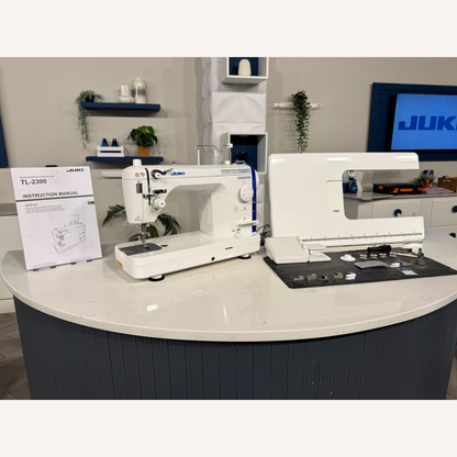 Juki TL-2300 Sumato Sewing Machine with 1/4", 1/8", 1/16", Teflon 3mm Compensating Feet & a Narrow Zip Foot.