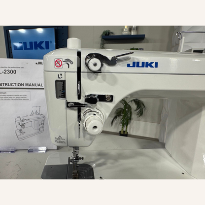 Juki TL-2300 Sumato Sewing Machine with 1/4", 1/8", 1/16", Teflon 3mm Compensating Feet & a Narrow Zip Foot.