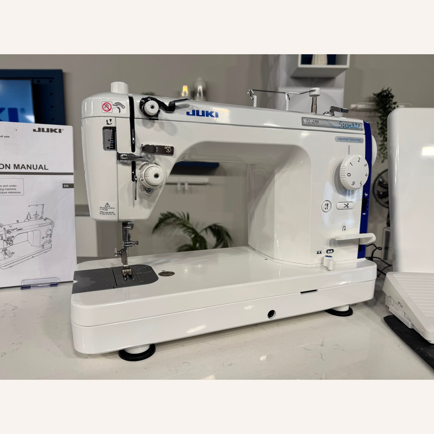Juki TL-2300 Sumato Sewing Machine with 1/4", 1/8", 1/16", Teflon 3mm Compensating Feet & a Narrow Zip Foot.