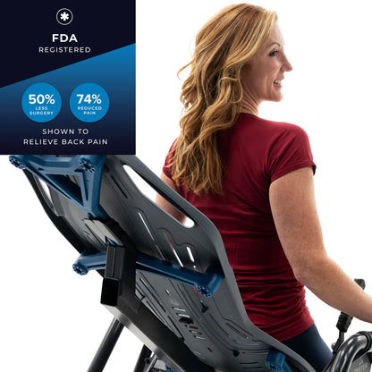 Middle ages woman in a casual, deep red, short sleeved, athletic T-Shirt sits with her back against the Teeter Fit Spine Inversion table. Text top the top left of the image reads FDA Registered. 50% less surgery. 74% reduced pain. Shown to relieve back paain.